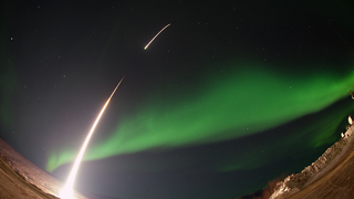 A NASA Rocket Soars Into an Emerald Aurora
